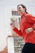 Side profile of a beautiful young woman jogging