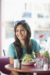 Beautiful woman eating food in a restaurant