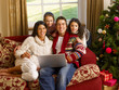 Photo: Hispanic family Christmas shopping online Hispanic family Christmas shopping online