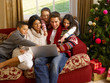 Photo: Hispanic family Christmas shopping online Hispanic family Christmas shopping online