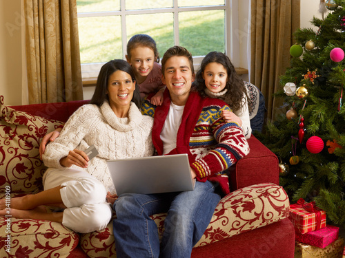Photo: Hispanic family Christmas shopping online Hispanic family Christmas shopping online