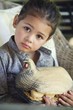 Portrait of a little girl holding model of turkey