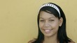 young college student smiling at camera