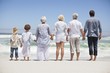 Rear view of a family looking at sea view from beach