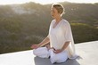 Mid adult woman meditating