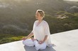 Mid adult woman meditating
