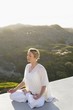 Mid adult woman meditating