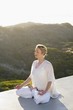 Mid adult woman meditating