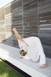 Mid adult woman stretching her arms