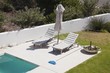 High angle view of lounge chairs at poolside