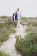 Senior couple walking on the beach