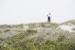 Side profile of a senior couple walking on the beach