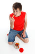 Child eating snakes confectionery