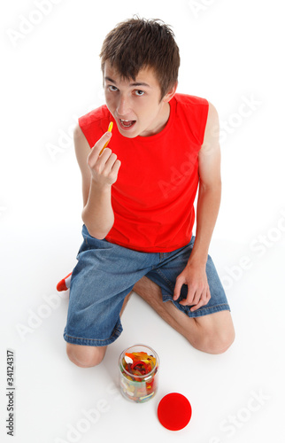 Photo: Child eating snakes confectionery Child eating snakes confectionery