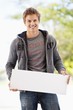 Portrait of a man holding a blank placard