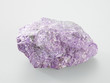 Foto: Mineral Sugilit on grey background Mineral Sugilit on grey background