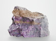 Foto: Mineral Sugilit on grey background Mineral Sugilit on grey background