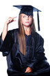 Gesticulating girl in graduation dress on isolated white