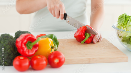 Photo: Woman cutting vegetables Woman cutting vegetables