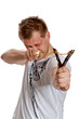 A man aims a slingshot