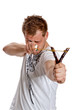 A man aims a slingshot