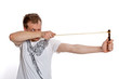A man aims a slingshot