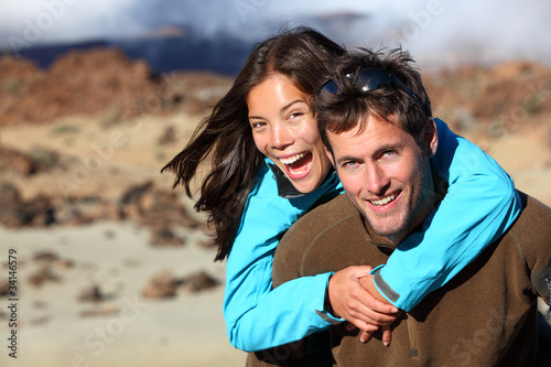 Photo: Happy young couple smiling outdoors Happy young couple smiling outdoors