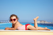 little  girl sunning at the pool