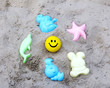 Yellow little ball and toys in the sandbox. Yellow little ball and toys in the sandbox.