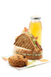 Two sandwiches, apple juice, cookie