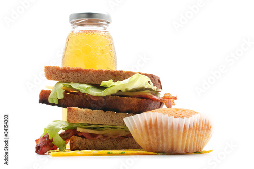 Photo: Sandwiches with bacon, juice, muffin (horizontal) Sandwiches with bacon, juice, muffin (horizontal)