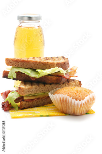 Photo: Sandwiches with bacon, juice, muffin Sandwiches with bacon, juice, muffin
