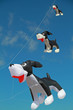 Dog shaped kite flying in clear blue sky