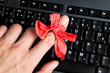 Red bow on finger