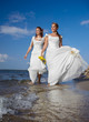 Photo: two brides on shore two brides on shore