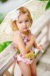 close-up portrait of beauty little girl with flower in her hair