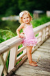 fashion little girl in tutu swimsuit outdoor