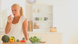 Woman eating slices of vegetables and fruit