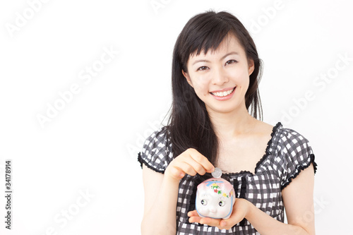 Photo: 貯金箱と女性 貯金箱と女性