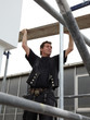 Scaffolder at work on a scaffold outside