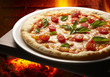 pizza nel forno a legna