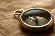 Vintage compass on vintage paper background Vintage compass on vintage paper background