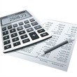 calculator and pen on a table of business background