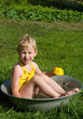 girl bathes in a bucket