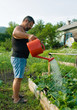 man watering plants