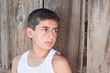 Boy against old barn wall Boy against old barn wall