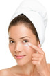 Skin care woman putting face cream Skin care woman putting face cream