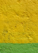 Photo: grunge concrete wall sprayed yellow and green grunge concrete wall sprayed yellow and green
