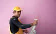 Photo: painting a wall pink by painters construction workers painting a wall pink by painters construction workers
