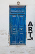 Old blue door with the inscription art